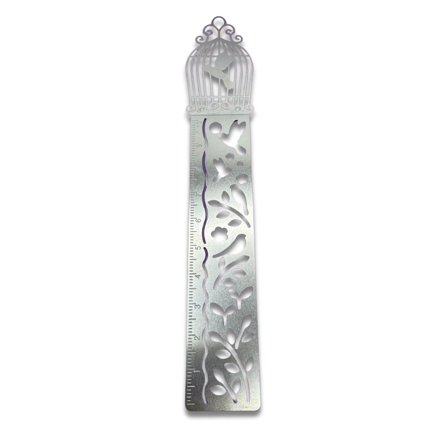 Decorative metal bird cage ruler bookmark with intricate designs on a white background