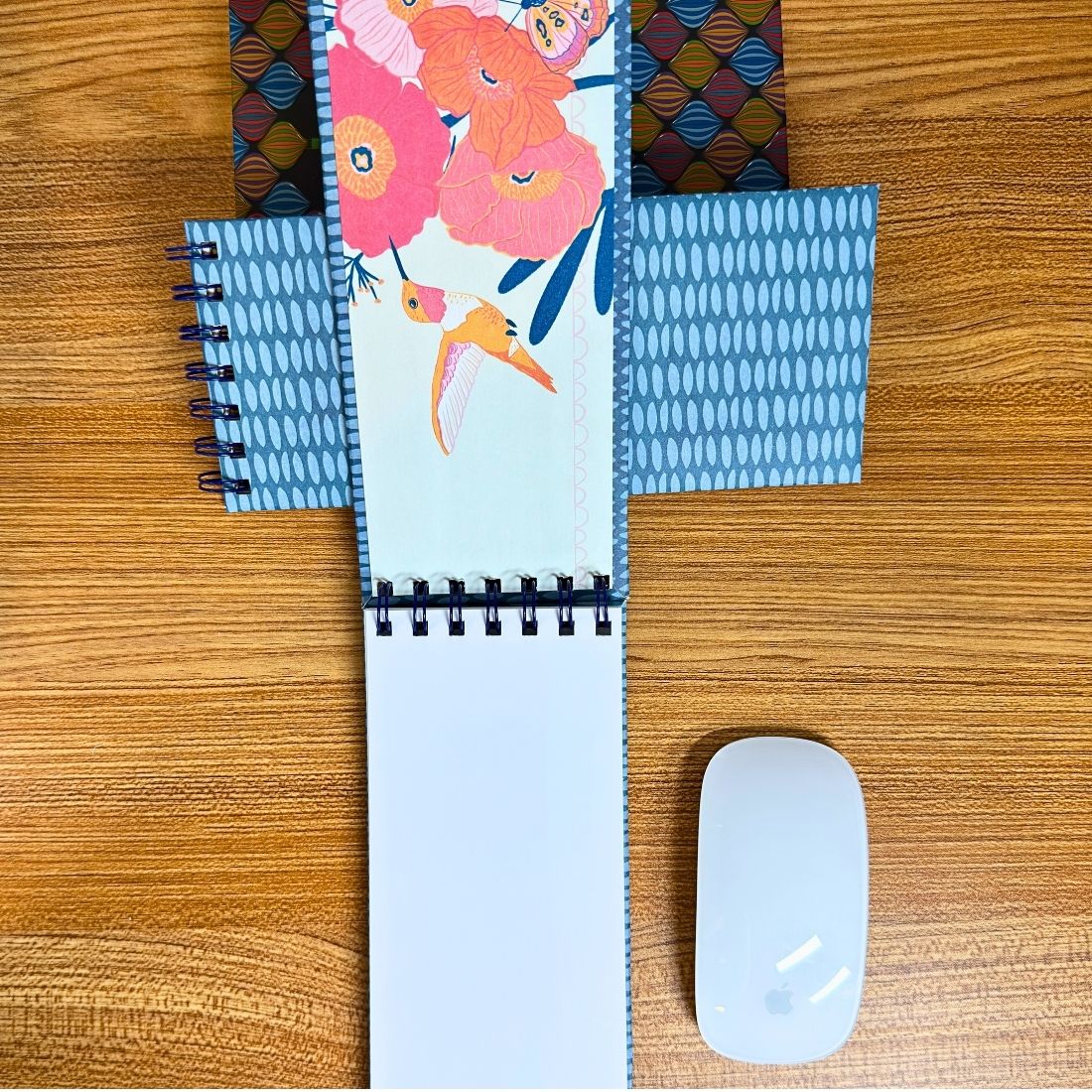 Blue Slim Spiral Notebook open to blank white pages
