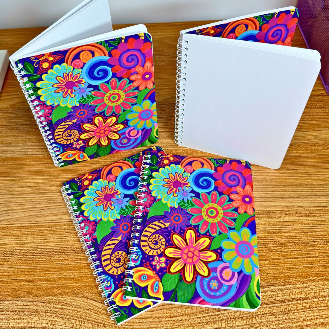 Colorful floral Wire-O notebook with blank white pages