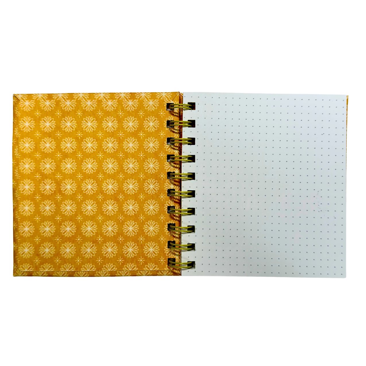 Interior view of the notebook showing the clean white dotted paper and yellow spiral binding.