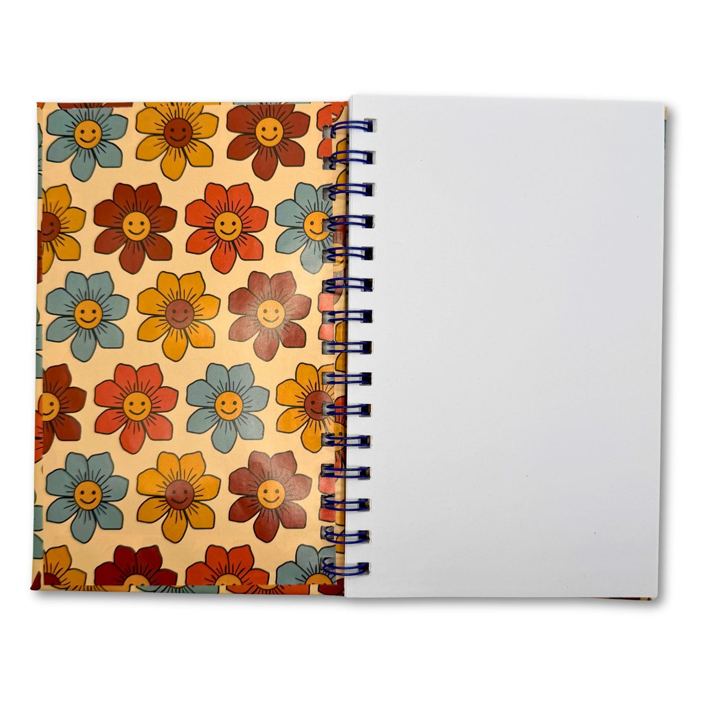 Groovy Flowers spiral notebook open showing blank recycled pages