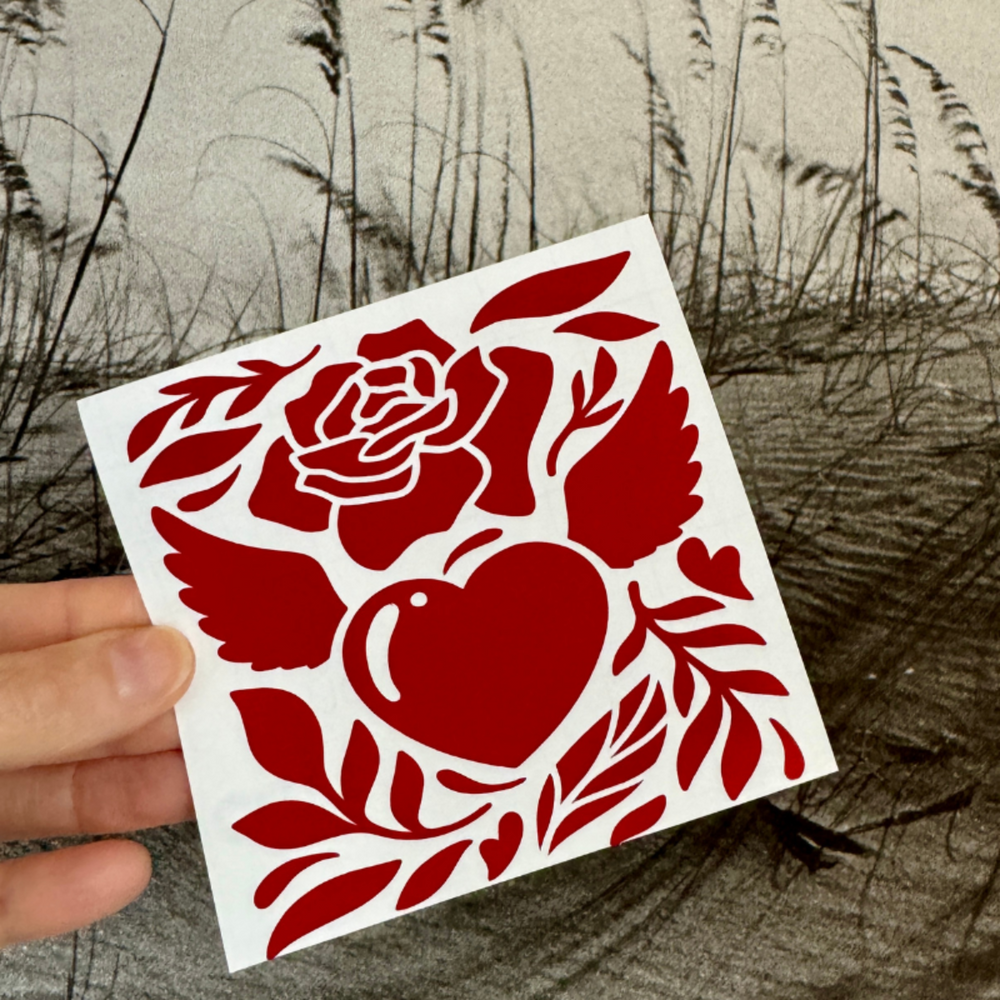 
                  
                    Durable Vinyl Heart & Rose Decal – Adds a Romantic Touch to Laptops and Mirrors
                  
                