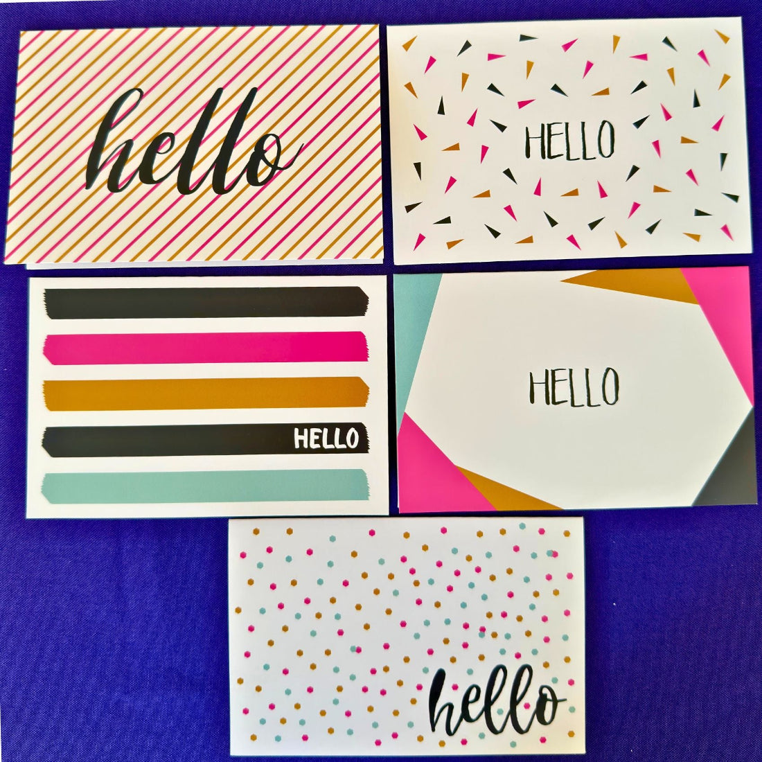 Set of colorful greeting cards with 'hello' text on a blue background