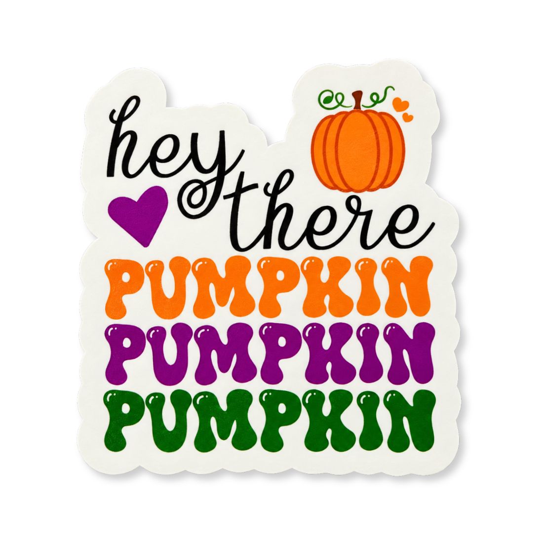 A die-cut sticker with a scalloped edge featuring the phrase 'hey there PUMPKIN PUMPKIN PUMPKIN' in colorful retro lettering, accompanied by a small orange pumpkin illustration and a purple heart on a white background.
