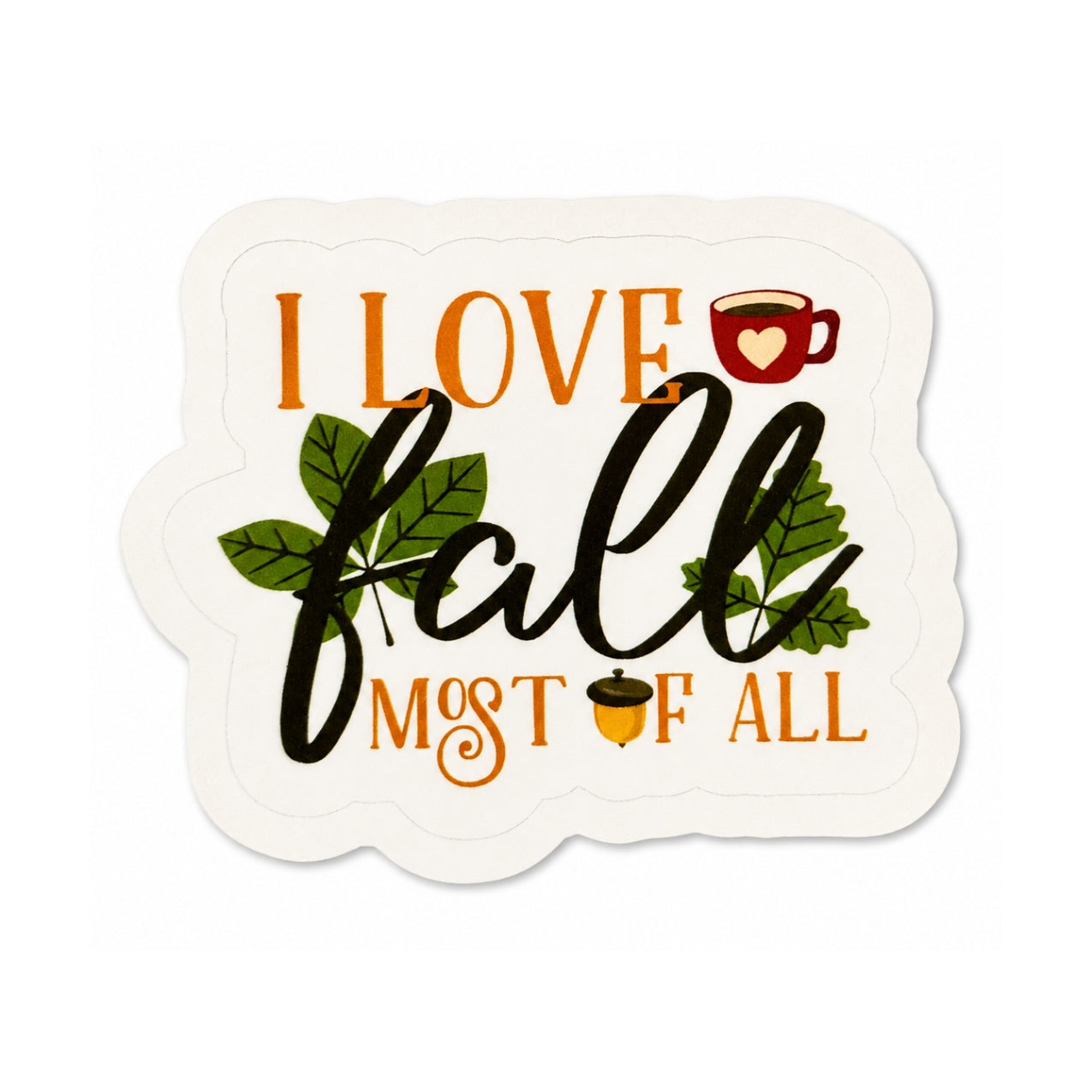 Love To Scribble die-cut sticker featuring the autumn phrase 'I LOVE fall MOST OF ALL' in orange and dark green lettering, decorated with green leaves, a red coffee mug with a heart, and an acorn on a white background.
