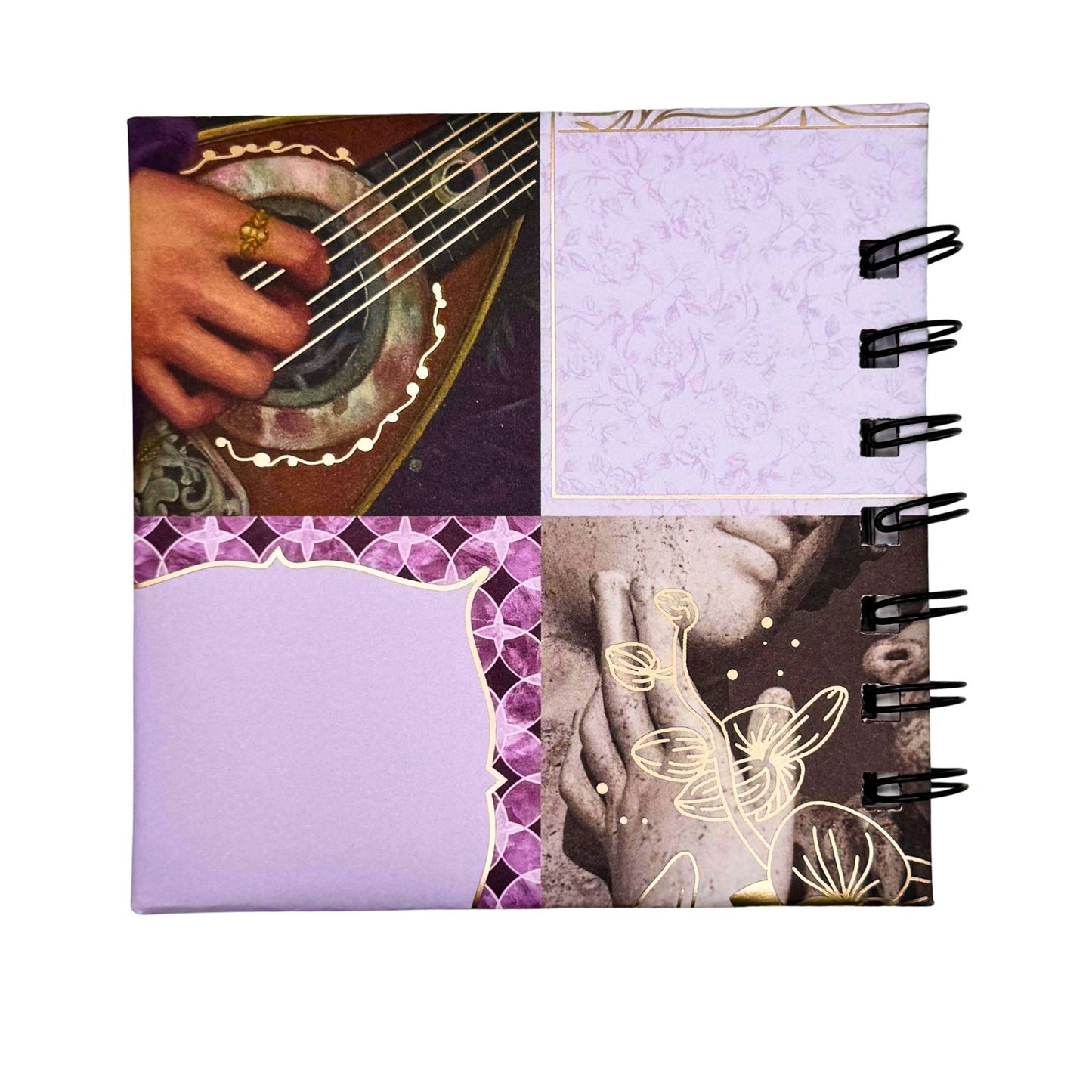 Notebook with artistic cover design featuring a hand playing a guitar and abstract patterns.