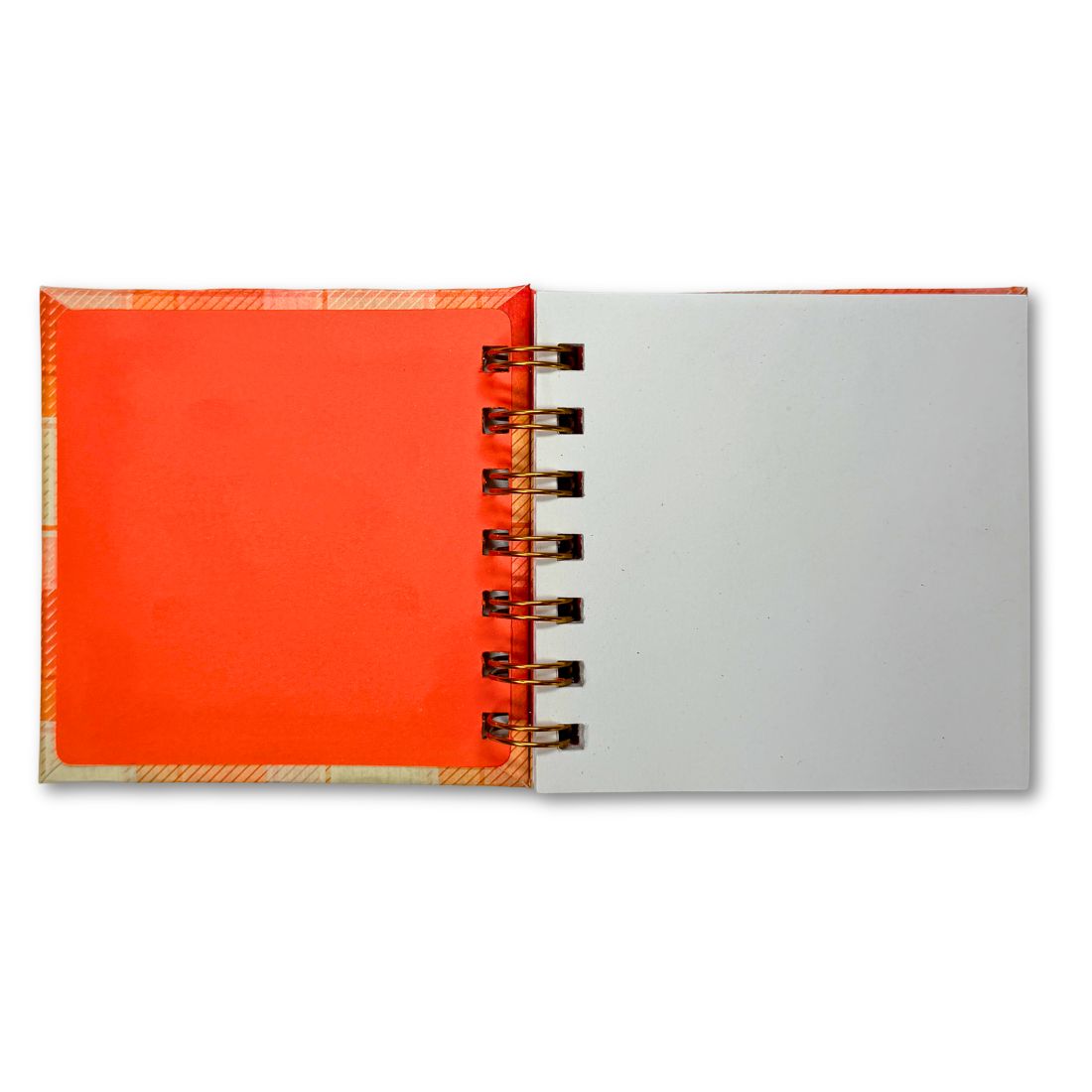 Open notebook with orange cover and white pages on a white background