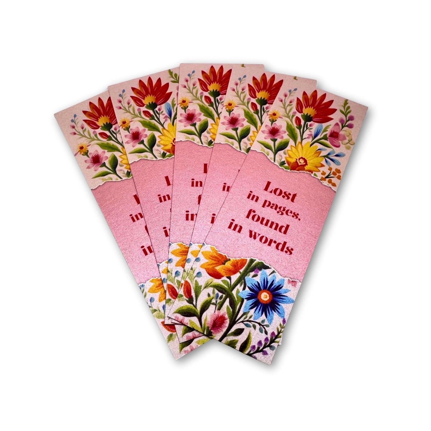 Set of five pink bookmarks with floral designs on a white background