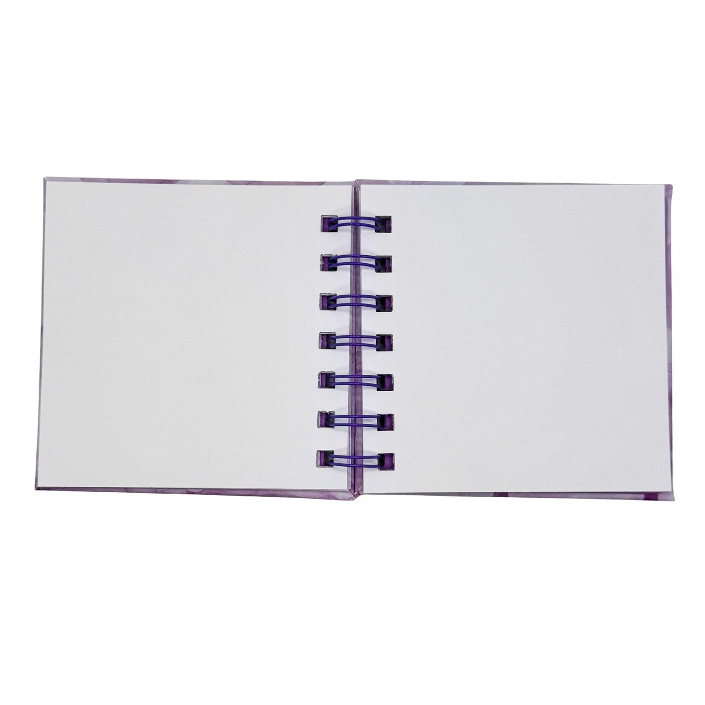 Open notebook with purple binding on a white background