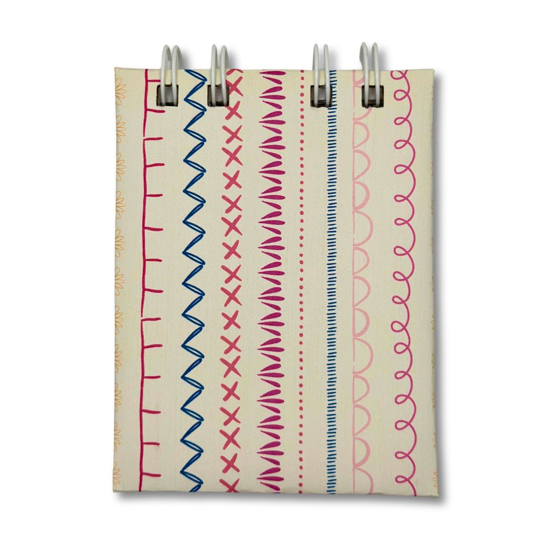 White extra mini notebook with blue and pink artsy lines